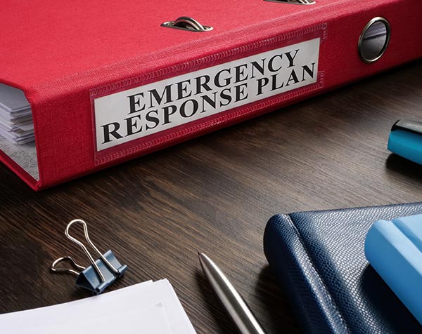 Photo of a binder labeled as emergency response plan