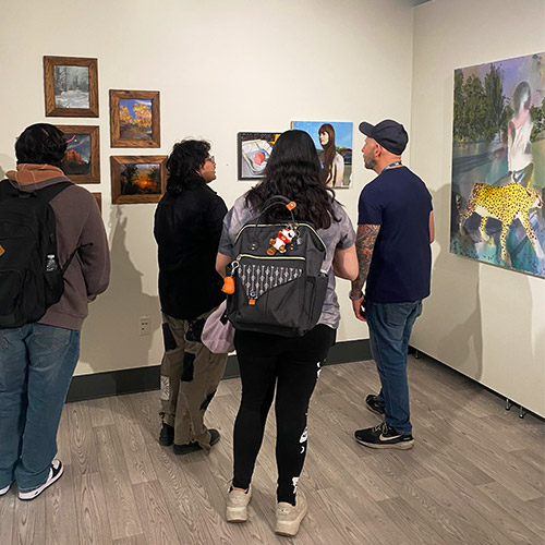 Visitors browse the art gallery