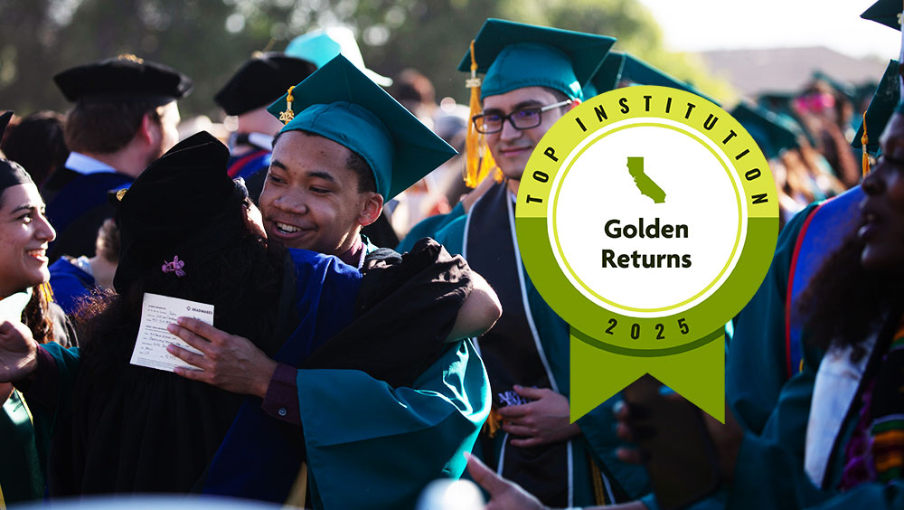 Photo of graduates hugging faculty in celebration at Commencement