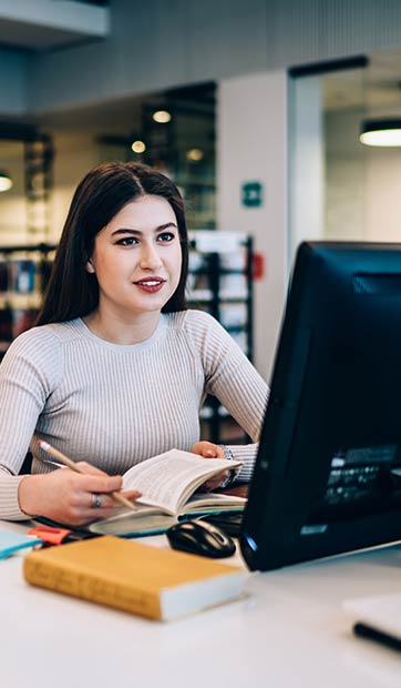 A student studies literature in the library