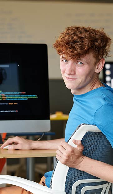 A student works on a programming project in class