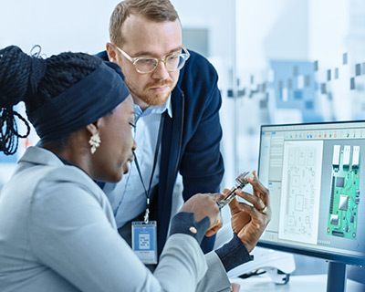 Electrical and computer engineers collaborating at work